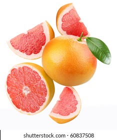 Falling grapefruit and grapefruit slices. Isolated on a white.