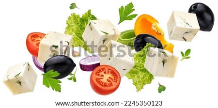 Falling greek salad ingredients isolated on white background, mediterranean food concept