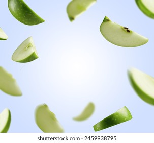 Falling green apple slices, isolated on white background. Apple product and juice banner design. Green fresh apple pieces floating in air. Fresh apple juice advertising and poster design.