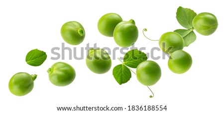 Falling green peas isolated on white background with clipping path
