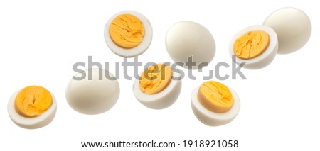 Falling hard boiled chicken eggs isolated on white background with clipping path