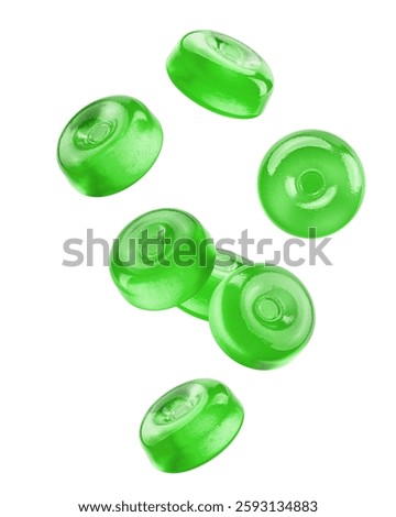 Falling Hard Candy, green fruit caramel, isolated on white background, clipping path, full depth of field