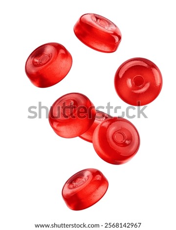 Falling Hard Candy, red fruit caramel, isolated on white background, clipping path, full depth of field