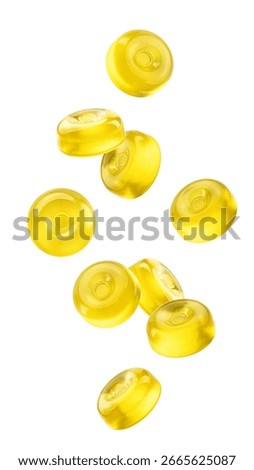Falling Hard Candy, yellow fruit caramel, isolated on white background, clipping path, full depth of field