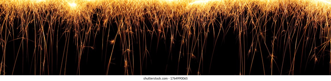 Falling Light Trails Of Hot Glowing Embers From A 4th Of July Sparkler Firework.