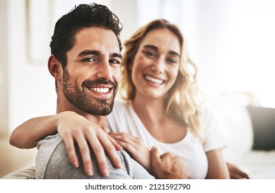 Falling in love more and more everyday - Shot of a couple relaxing at home - Powered by Shutterstock