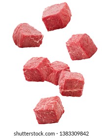 Falling meat, beef, cube, isolated on white background, clipping path, full depth of field