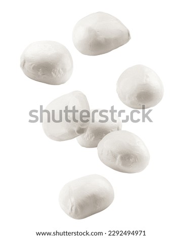 Falling Mozzarella cheese isolated on white background, clipping path, full depth of field