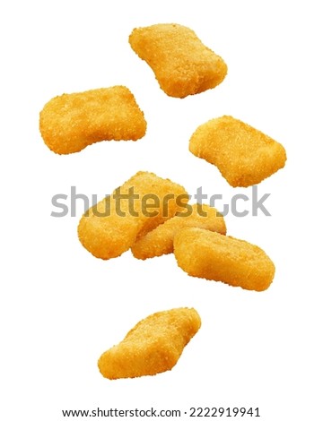 Falling Nuggets isolated on white background, clipping path, full depth of field