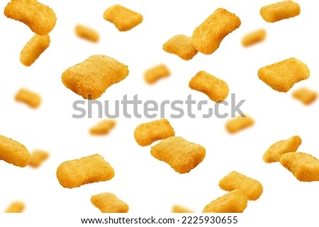 Falling Nuggets isolated on white background, selective focus