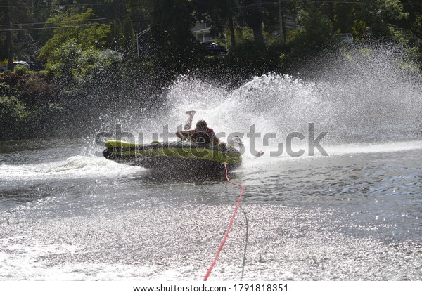 Falling off a speedboat water
tube 