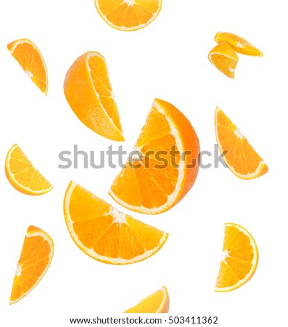 Falling orange and orange slices. Isolated on a white background.