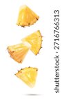 Falling pineapple slices isolated on white background.