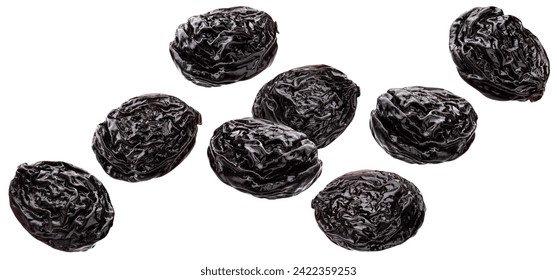 Falling prunes isolated on white background