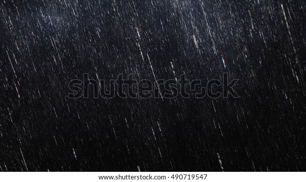 Falling raindrops footage animation in slow\
motion on dark black background with fog, lightened from top, rain\
animation with start and end, perfect for film, digital\
composition, projection\
mapping