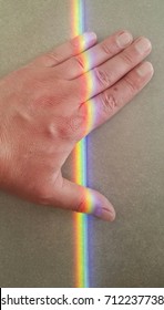 the falling range on hand. rainbow on the hand