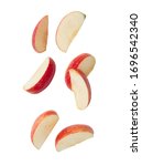 Falling red apple slice isolated on white background with clipping path.