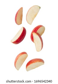 Falling red apple slice isolated on white background with clipping path.