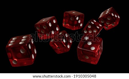 Falling red dice on dark background 