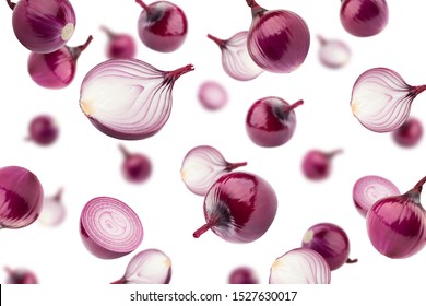 Falling red onion isolated on white background, selective focus
