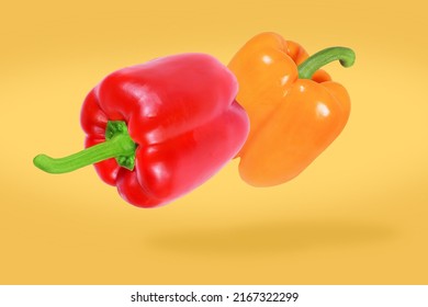 Falling Red And Orange Peppers. Flying Vegetables