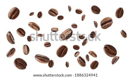 falling roasted aromatic coffee beans on white background