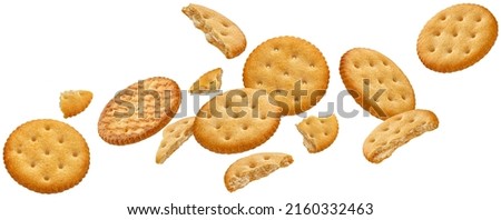 Falling round cheese crackers isolated on white background