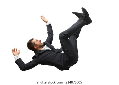 falling and screaming businessman in formal wear over white background