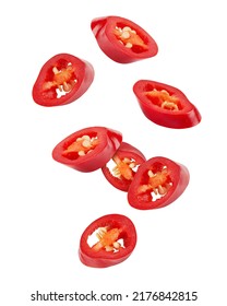 Falling sliced red hot chili peppers isolated on white background, clipping path