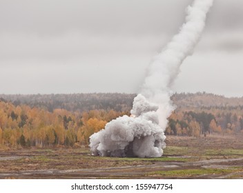 falling smoke trail in the sky and the explosion on the ground