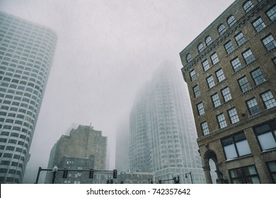 Falling Snow In Downtown Boston. Snowstorm Among The High-rise Buildings