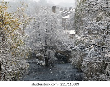Falling Snow Over The River In The West Yorkshire Town Of Hebden Bridge