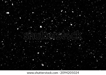 Falling snow texture isolated on black background
