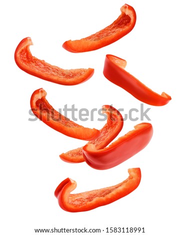 Falling sweet pepper slices, paprika, isolated on white background, clipping path, full depth of field
