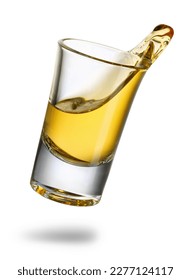 falling tequila shot with splash isolated on white background