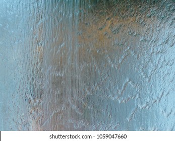 Falling Water On Glass Wall , Blurred Background