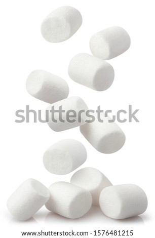 Falling white marshmallows, isolated on white