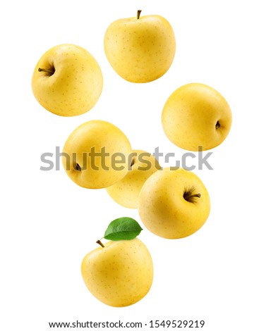 Falling yellow apple isolated on white background, clipping path, full depth of field