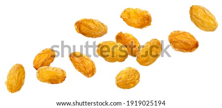 Falling yellow raisins isolated on white background with clipping path