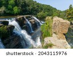 The falls at High Falls Park create a stunning rainbow in the Alabama mist.