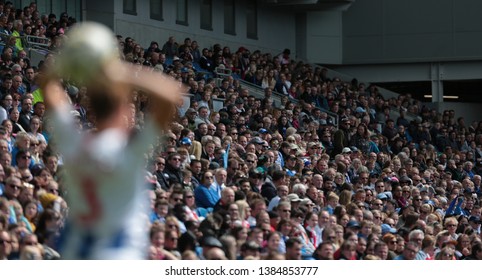 FALMER, BRIGHTON, EAST SUSSEX / UNITED KINGDOM - APRIL 28 2019: Crowd Watches On During The Match Between Arsenal And Brighton And Hove Albion In The FAWSL Match At American Express Community Stadium.