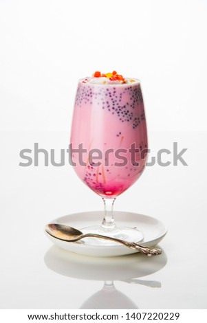 Falooda / Faluda is a popular Indian dessert - Strawberry and Mango flavoured which has Ice cream, noodles, sweet basil seeds and nuts, selective focus