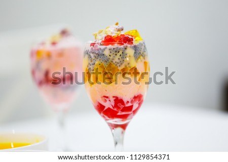 Falooda, a popular cold dessert of the Indian subcontinent. Falooda is mixed with rose syrup, vermicelli, sweet basil seeds, pieces of jelly with milk and topped off with a scoop of ice cream.