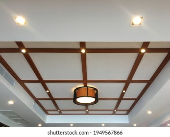 false ceiling decorated with wood and lamp