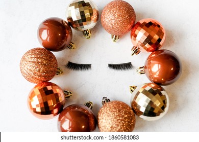 False Eyelashes With Christmas Golden Balls . Makeup Concept