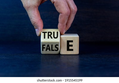 False or true symbol. Businessman flips a wooden cube and changes the word 'false' to 'true' or vice versa. Beautiful grey background, copy space. Business and false or true concept. - Shutterstock ID 1915545199