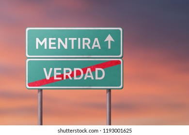 false and truth - green traffic sign with inscriptions in Spanish