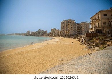 Famagusta, Cyprus - 12 Aug 2024:Varosha, once a thriving seaside resort in Famagusta, now stands eerily abandoned, its beach deserted and buildings decaying. - Powered by Shutterstock