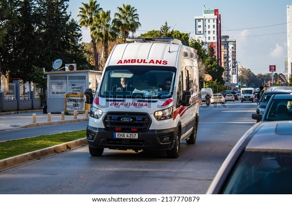 Famagusta, Northern Cyprus - January 07,\
2022 Ambulance driving through the streets of Famagusta during the\
coronavirus outbreak hitting Northern\
Cyprus