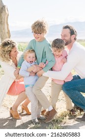 Family Of 5 With A Mom And Dad. There Are Only Boy Children, 3 Of Them. Everyone Is Happy.